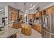 Spacious kitchen featuring custom cabinetry, granite countertops, stainless steel appliances, and a kitchen island at 2641 E Birchwood Pl, Chandler, AZ 85249