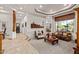 Spacious living room with natural light, showcasing elegant decor and seamless transitions to other living spaces at 2641 E Birchwood Pl, Chandler, AZ 85249