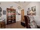 Inviting living room featuring hardwood floors, wooden hutch and wood framed door at 2641 E Birchwood Pl, Chandler, AZ 85249