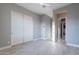 Spacious bedroom with light flooring, modern closet doors and plenty of natural light at 26879 N 100Th Ln, Peoria, AZ 85383