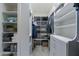 Organized walk-in closet with custom shelving for optimal storage at 26879 N 100Th Ln, Peoria, AZ 85383