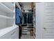 Well-organized walk-in closet featuring custom storage solutions at 26879 N 100Th Ln, Peoria, AZ 85383