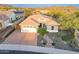 Beautiful home with a brick driveway, two-car garage, desert landscaping, and mountain views at 26879 N 100Th Ln, Peoria, AZ 85383