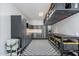 Well-organized garage space with ample storage, cabinets, and a functional workspace at 26879 N 100Th Ln, Peoria, AZ 85383
