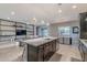 Modern kitchen showcasing a large island, stainless steel appliances, and open layout at 26879 N 100Th Ln, Peoria, AZ 85383