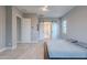 Bright and airy main bedroom featuring barn doors and recessed lighting at 26879 N 100Th Ln, Peoria, AZ 85383