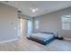 Spacious main bedroom with modern platform bed and sliding barn doors at 26879 N 100Th Ln, Peoria, AZ 85383
