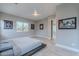 Stylish main bedroom with decorative wall art and abundant natural light at 26879 N 100Th Ln, Peoria, AZ 85383