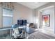 Functional home office with a large desk, comfortable chair, and natural light at 26879 N 100Th Ln, Peoria, AZ 85383
