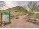 A scenic view of a trail marker next to a concrete picnic table near Calderwood Butte at 26879 N 100Th Ln, Peoria, AZ 85383