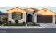 Charming single-story home featuring a tile roof, desert landscaping, and a two-car garage at 27636 W Runion Dr, Buckeye, AZ 85396