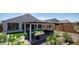 Expansive backyard featuring a covered patio, artificial turf, and low-maintenance desert landscaping at 27636 W Runion Dr, Buckeye, AZ 85396