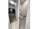 Half-bath with neutral tones, tile flooring, and toilet, positioned between the main bathroom and walk-in closet at 27636 W Runion Dr, Buckeye, AZ 85396