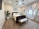 Cozy bedroom featuring carpet flooring, a ceiling fan, and natural light at 27636 W Runion Dr, Buckeye, AZ 85396