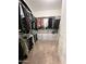 Spacious walk-in closet featuring organized storage with rods and shelves, and carpeted flooring at 27636 W Runion Dr, Buckeye, AZ 85396