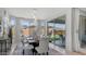 Elegant dining room featuring modern lighting, large windows with backyard view and dining for six at 27636 W Runion Dr, Buckeye, AZ 85396