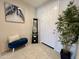 Cozy entryway featuring bench seating, decorative art, and a plant at 27636 W Runion Dr, Buckeye, AZ 85396