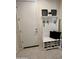 Organized entryway with a hall tree, bench, and shoe storage for convenience at 27636 W Runion Dr, Buckeye, AZ 85396