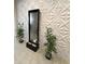 Modern home with beautiful water fountain and unique textured walls at 27636 W Runion Dr, Buckeye, AZ 85396