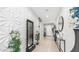 Inviting hallway with decorative wall and water feature, a calming ambiance at 27636 W Runion Dr, Buckeye, AZ 85396