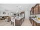Modern kitchen with stainless appliances, large island, and granite countertops at 27636 W Runion Dr, Buckeye, AZ 85396