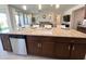 Open concept kitchen with an island, granite countertops and stainless steel appliances at 27636 W Runion Dr, Buckeye, AZ 85396