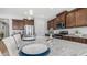 Kitchen island featuring granite countertops, stainless steel appliances, and ample cabinet space at 27636 W Runion Dr, Buckeye, AZ 85396