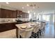 Charming kitchen with a large island, white countertops, and modern lighting at 27636 W Runion Dr, Buckeye, AZ 85396