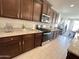 Gourmet kitchen featuring stainless steel appliances and granite countertops at 27636 W Runion Dr, Buckeye, AZ 85396