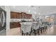Bright kitchen with granite countertops, stainless steel appliances, and a large island with bar stool seating at 27636 W Runion Dr, Buckeye, AZ 85396