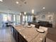Open concept kitchen featuring a large center island, recessed lighting and an adjoined living and dining area at 27636 W Runion Dr, Buckeye, AZ 85396