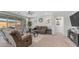 Inviting living room with comfortable seating, a ceiling fan, and sliding glass doors to the patio at 27636 W Runion Dr, Buckeye, AZ 85396
