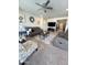 Open-concept living room with plush sofas, stylish decor, and a seamless transition to other living spaces at 27636 W Runion Dr, Buckeye, AZ 85396