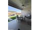 Outdoor patio with comfortable seating, a fan, and a view of the backyard at 27636 W Runion Dr, Buckeye, AZ 85396