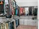 Walk-in closet with ample hanging space and cubbies for organization at 27636 W Runion Dr, Buckeye, AZ 85396