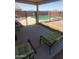 Backyard view of a fenced pool and a patio with outdoor seating at 284 W Settlers Trl, Casa Grande, AZ 85122