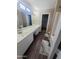 Bathroom with double sink and a large mirror at 284 W Settlers Trl, Casa Grande, AZ 85122