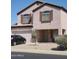 Charming two-story home with a two car garage, landscaped yard, and a neutral exterior at 284 W Settlers Trl, Casa Grande, AZ 85122