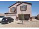 Charming two-story home with a two car garage, landscaped yard, and a neutral exterior at 284 W Settlers Trl, Casa Grande, AZ 85122