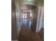 View from tile floored hallway into a naturally lit living area at 284 W Settlers Trl, Casa Grande, AZ 85122