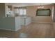 Bright kitchen features stainless steel appliances, ample counter space, and a cozy dining area at 284 W Settlers Trl, Casa Grande, AZ 85122