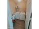 Laundry room including washer and dryer, neutral walls and flooring at 284 W Settlers Trl, Casa Grande, AZ 85122