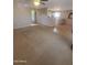 An open floor plan featuring both carpet and tile flooring, offering a versatile living space at 284 W Settlers Trl, Casa Grande, AZ 85122