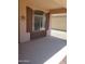 Covered patio with view into neighboring yard featuring rock landscaping at 284 W Settlers Trl, Casa Grande, AZ 85122