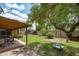 Backyard featuring a covered patio, shed, swing, and lawn at 2913 E Earll Dr, Phoenix, AZ 85016