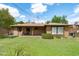 Expansive backyard featuring a covered patio and lush green lawn at 2913 E Earll Dr, Phoenix, AZ 85016