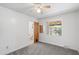 Bedroom with neutral-toned walls and carpet, view of bathroom and backyard at 2913 E Earll Dr, Phoenix, AZ 85016