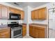 Well-equipped kitchen with stainless steel appliances and ample cabinet space at 2913 E Earll Dr, Phoenix, AZ 85016