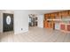 Bright living room featuring a large tile floor and built-in shelving at 2913 E Earll Dr, Phoenix, AZ 85016