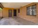 Covered patio area featuring brick siding and a secured entrance, offering space and security for outdoor activities at 2913 E Earll Dr, Phoenix, AZ 85016